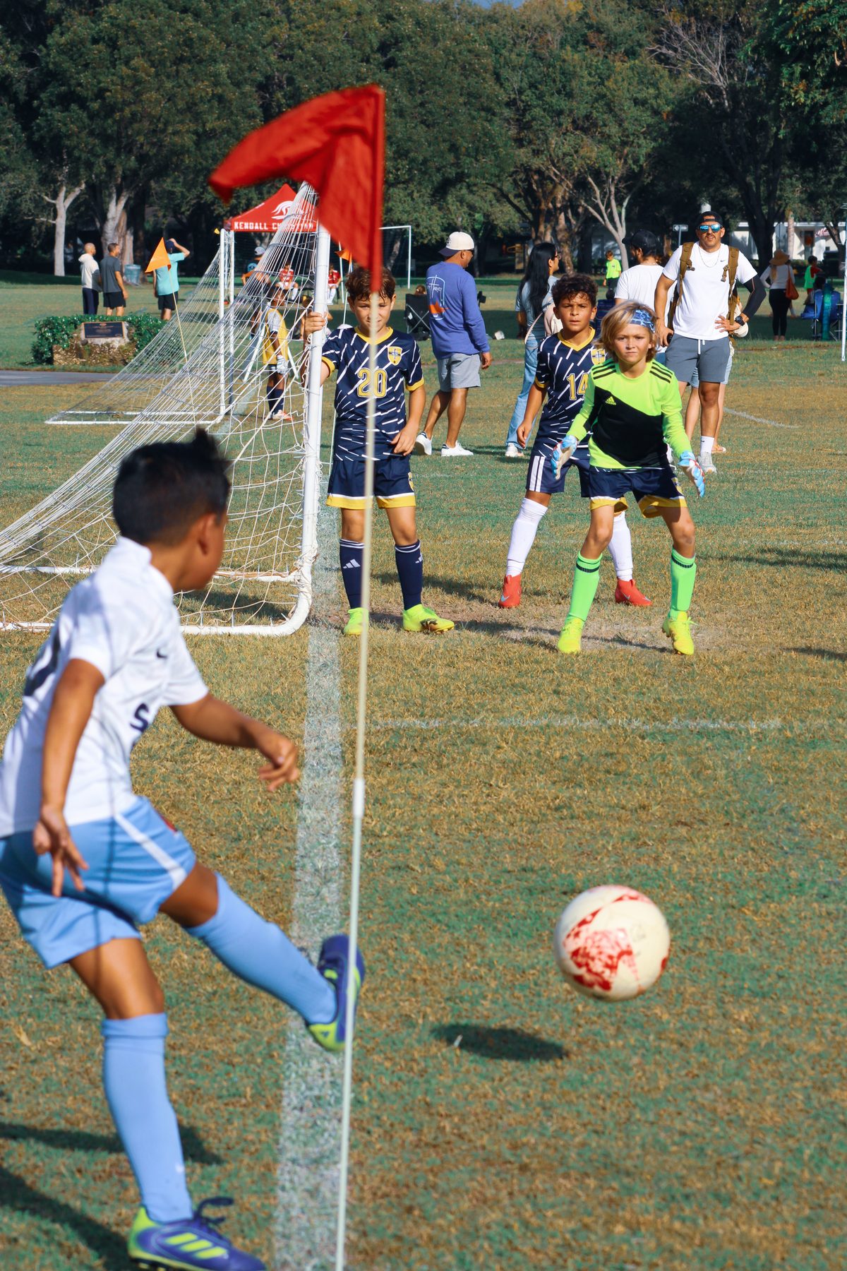 SFK player taking a corner kick in a competitive match